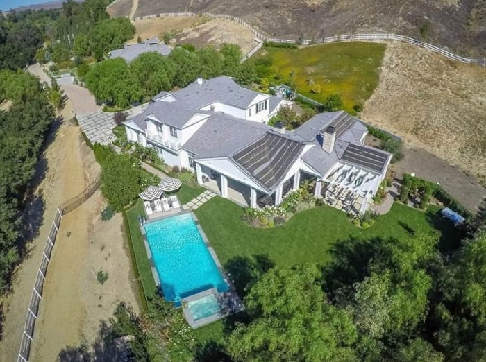 Blac Chyna mansion from top view with a swimming pool which in on a green garden 